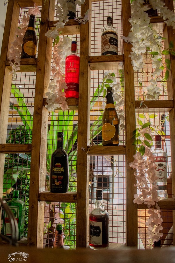 Botanical bottle display wall at Platform